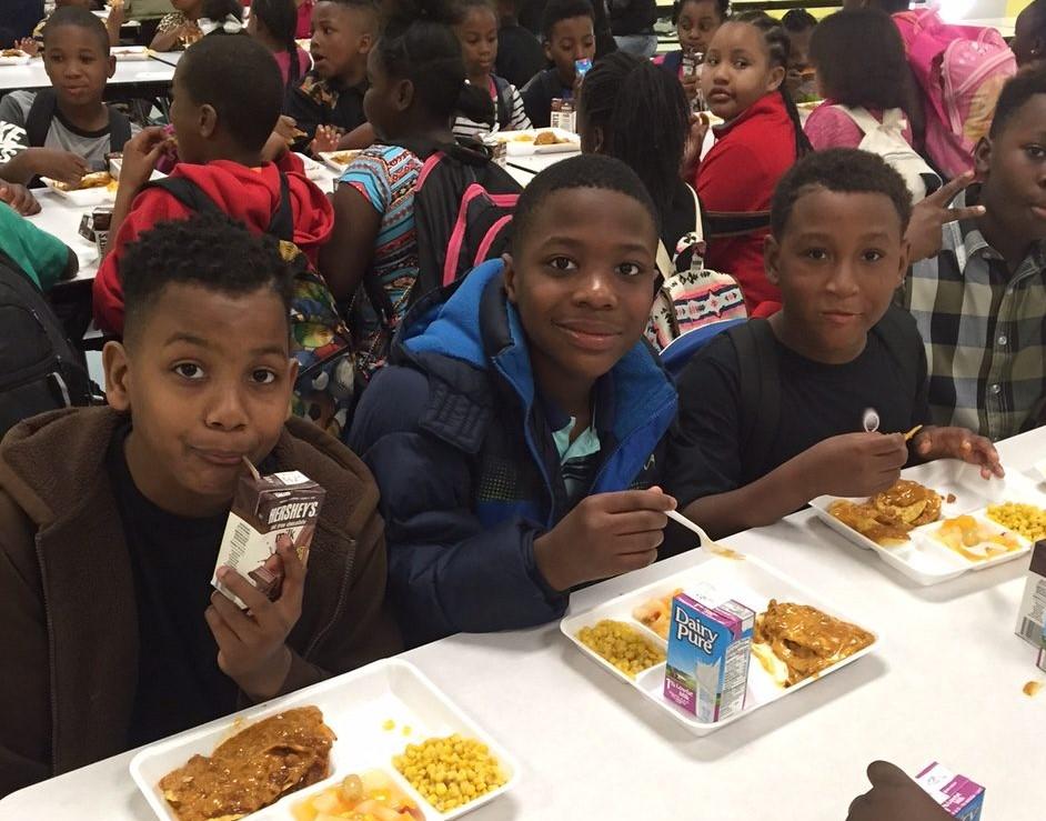 Children eat at the Reconstructing Youth Foundation in Tyrone, Georgia. 