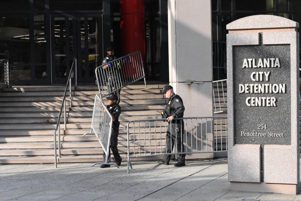 Police set up protective barricades in front of the Atlanta City Detention Center Saturday June 30.