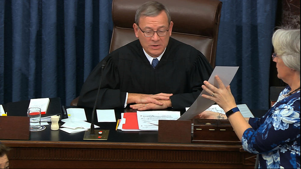 In this image from video, presiding officer Supreme Court Chief Justice John Roberts reads the results of an amendment offered by Senate Minority Leader Chuck Schumer, D-N.Y., during the impeachment trial against President Donald Trump in the Senate.