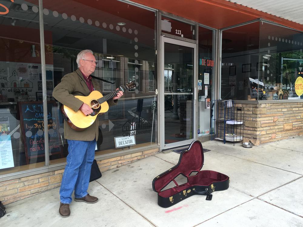 Jim Anderson plays for tips and performance practice in Decatur