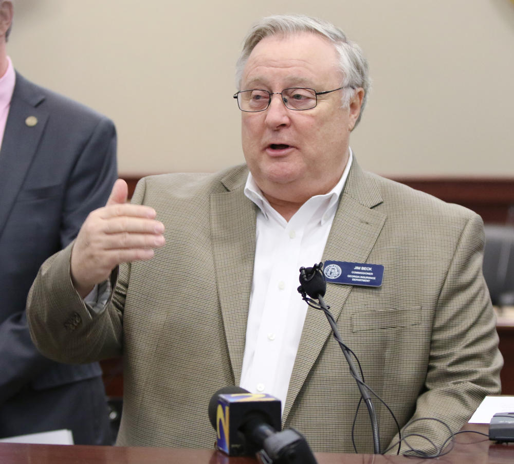 Jim Beck, commissioner of the Georgia Insurance Department, speaks at a press conference about an insurance fraud bust in a courtroom at the Clayton County Superior Court in Jonesboro. Three victims of the insurance fraud have been identified.