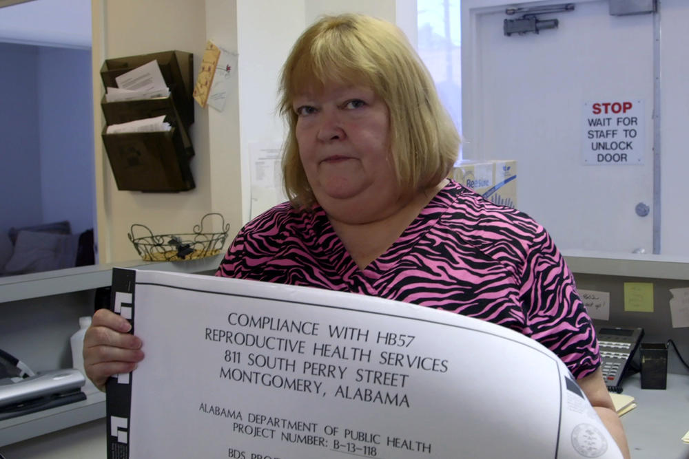 June Ayers, co-owner of Reproductive Health Services in Montgomery, Ala. displays blueprints for changes to her clinic that are necessary to adhere to new state guidelines