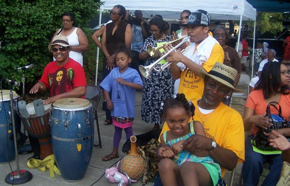Musicians and attendees interact at a previous Juneteenth Freedom Festival in Macon. This year is the festival's 27th year, and it takes place Saturday in Tattnall Square Park.