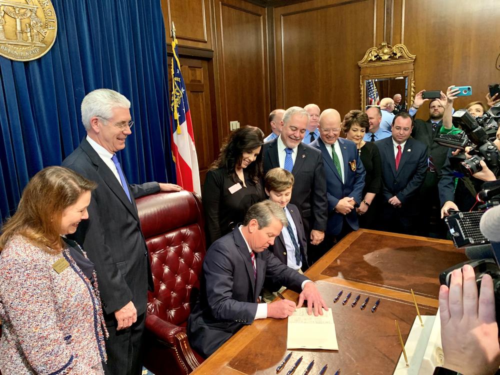 Gov. Brian Kemp signs his first law Friday, Feb. 15.