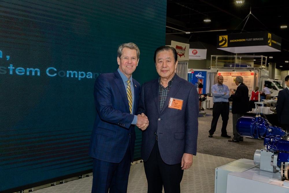 Gov. Brian Kemp (left) and Sangsin Chairman Hyoil Kim.