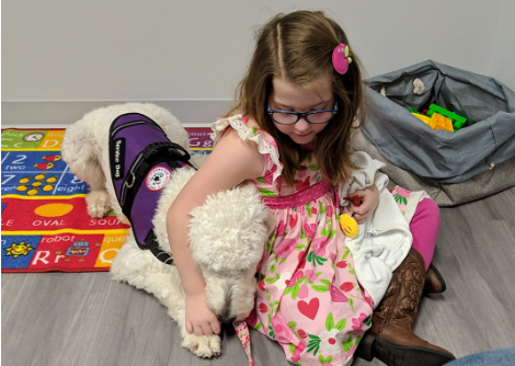 Kira Johnson and her service dog, Hera.