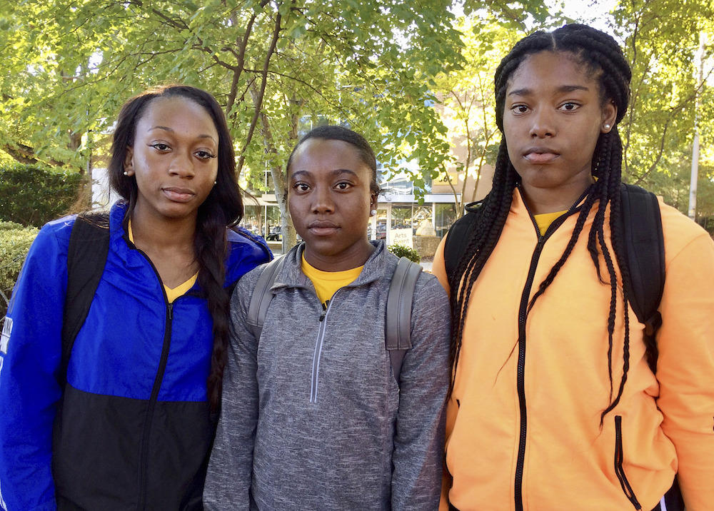 KSU cheerleaders, from left to right, Shlondra Young, Tommia Dean and Kennedy Town are part of a group of cheerleaders that say they'll take a knee in the stadium tunnel when the national anthem is played at Saturday's homecoming game.