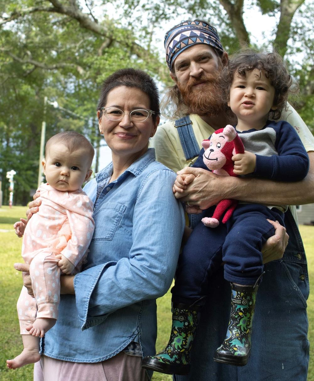 Kyle BlackCatTips Brooks, a folk artist from Georgia, with his family during the April 2020 coronavirus pandemic.