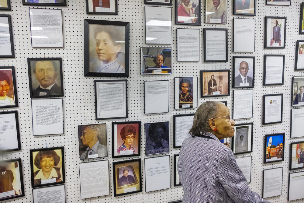 Anne Richardson Gayles-Felton, right, near a reproduction of a painting of her grandmother, Anna Wade Richardson, left, in the Lamson Richardson School Musuem in 2019. Richardson founded the school for African American children in 1886. 