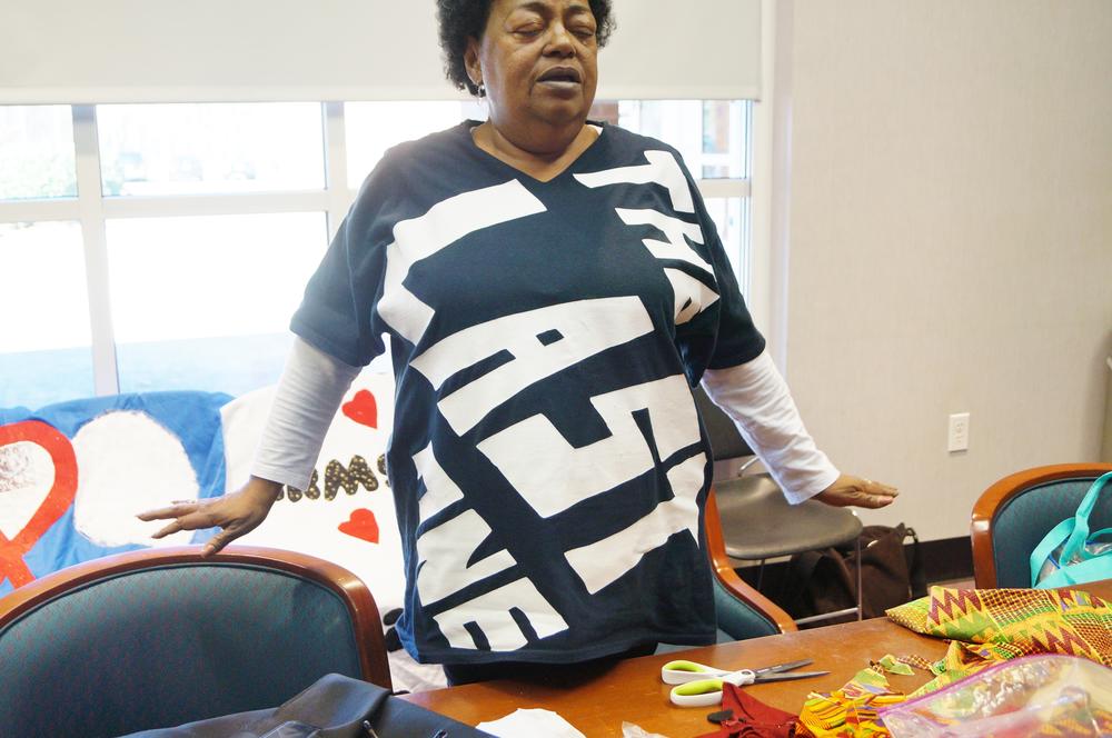 Stephanie Laster, an HIV/AIDS awareness activist, prepares to share  her 'living quilt' at show and tell.