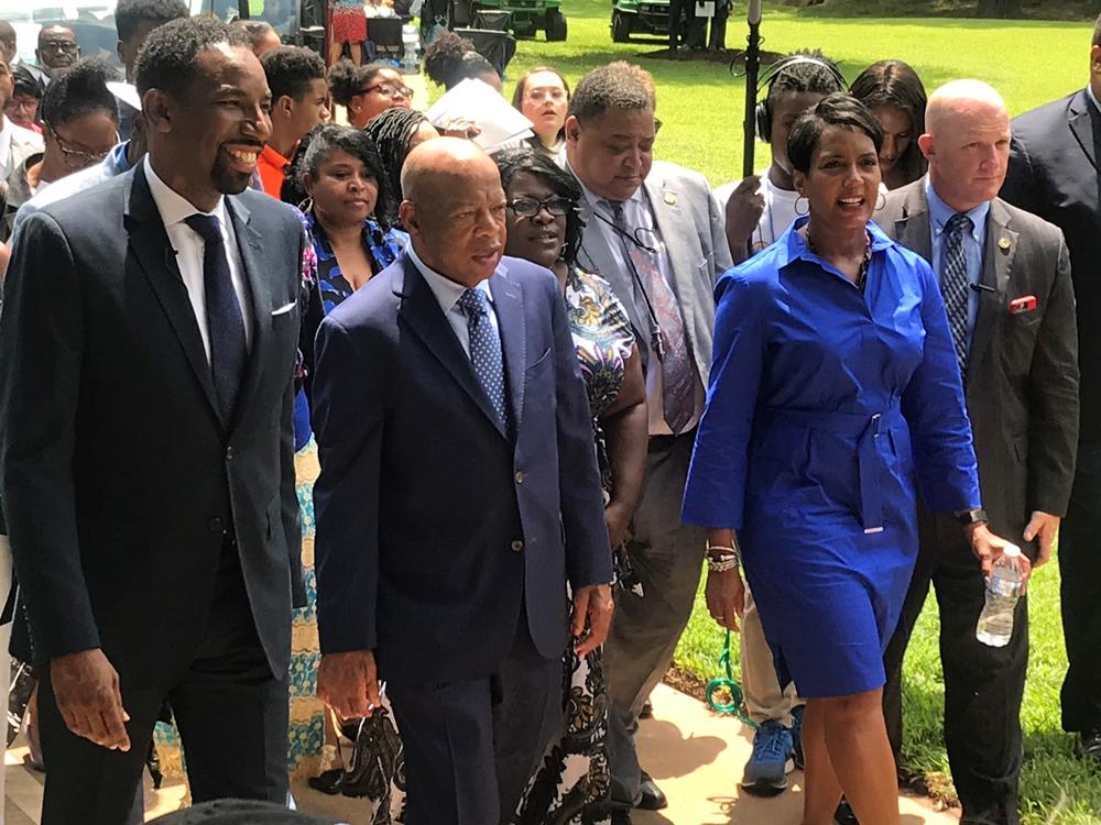 Atlanta city councilman Andre Dickens, John Lewis and Mayor Bottoms walk up John Lewis Plaza.