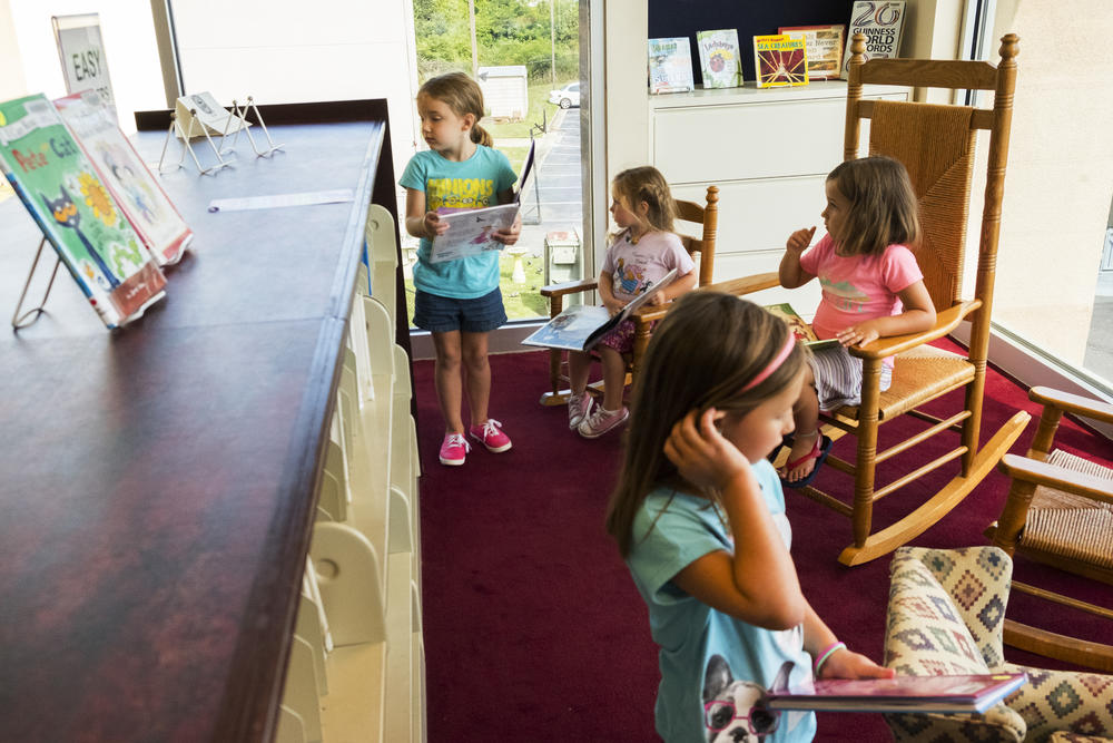 Children browse the shelves at the Riverside Library in Macon. Most of Macon's libraries will be closed due to a county budget fight.