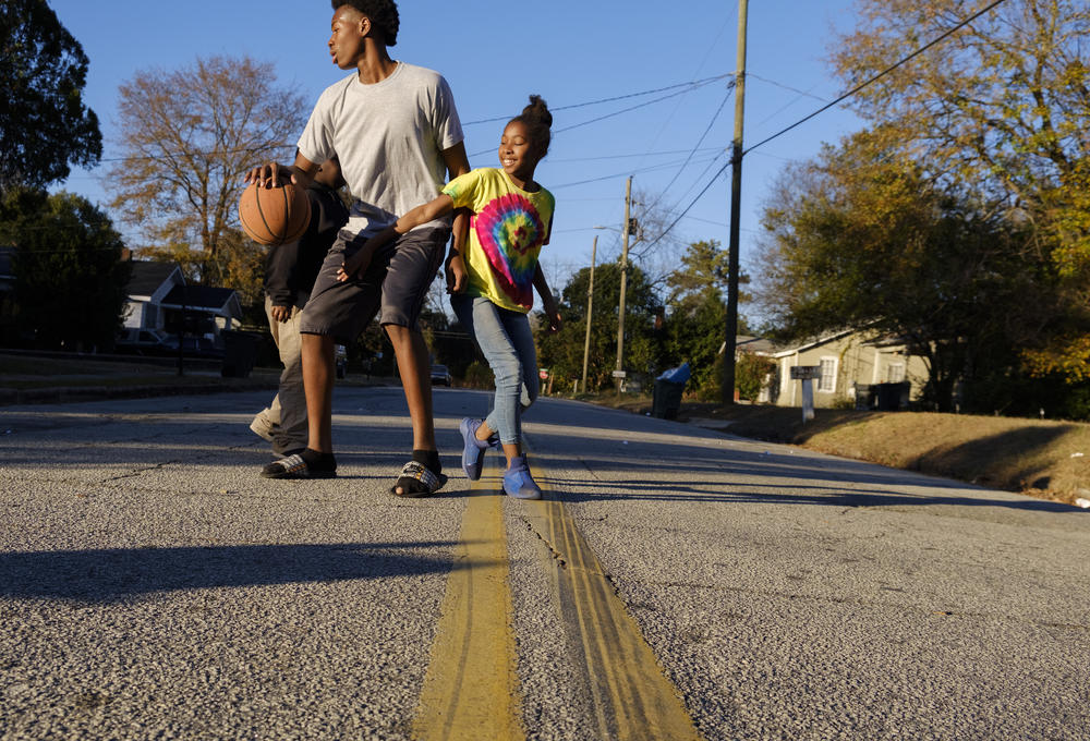 Children play on a side street in the Macon neighborhood with the lowest life expectancy in Georgia, 63 years. The neighborhood has over 11 percent unemployment and a median income of under $20,000 a year. 