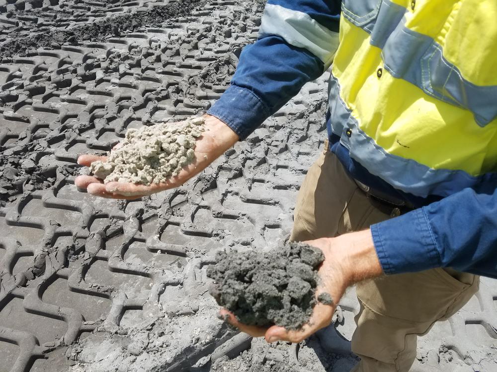 The mine separates lighter mineral sand (left) from heavy, darker minerals like titanium and zirconium.