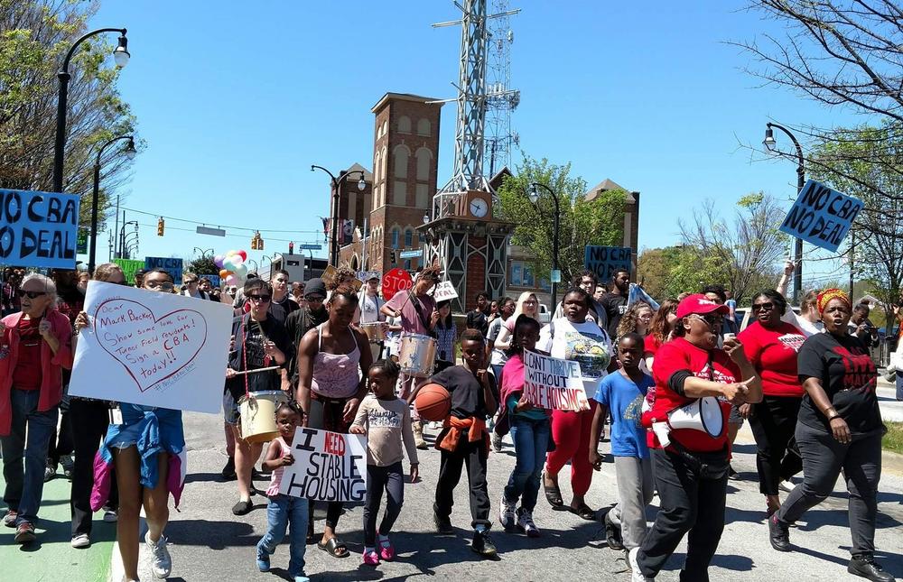 The Turner Field Community Benefits Coalition demonstrates on Saturday, April 1, 2017. The group worries the future development of Turner Field will lead to gentrification  in surrounding neighborhoods.