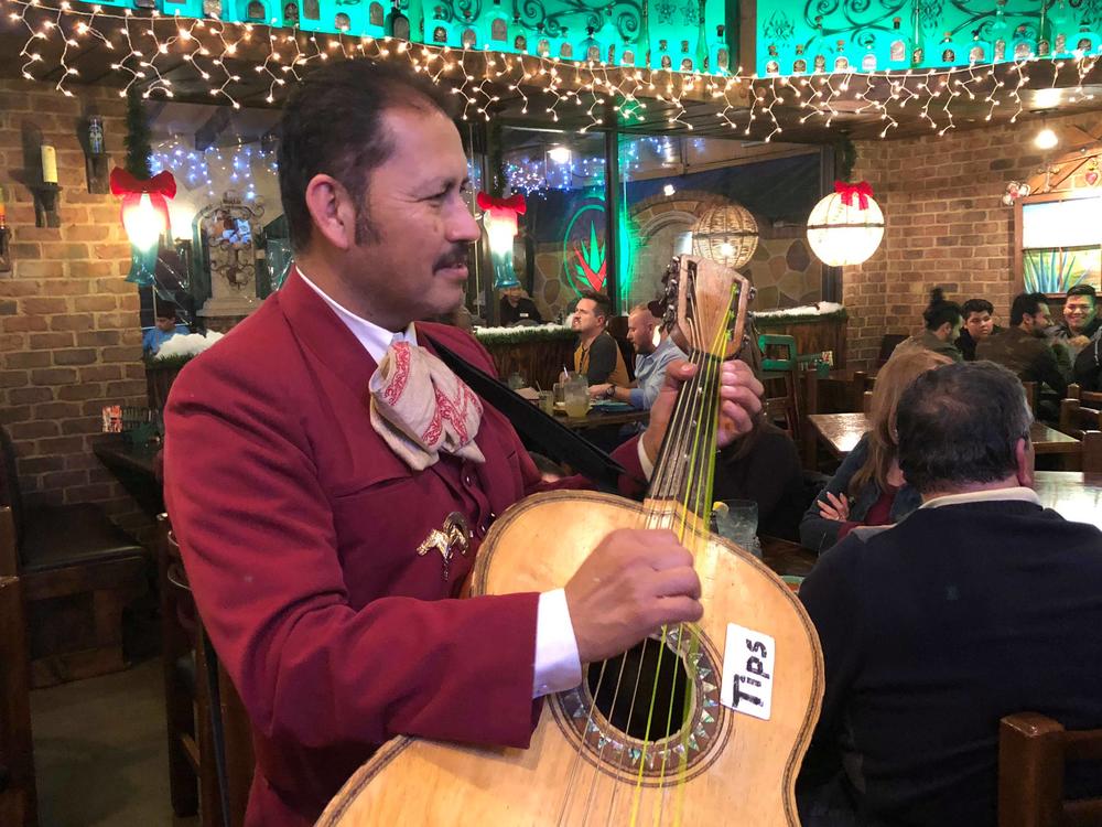 Jose Lara plays the guitarron at Agavero Cantina in Lilburn, Georgia.