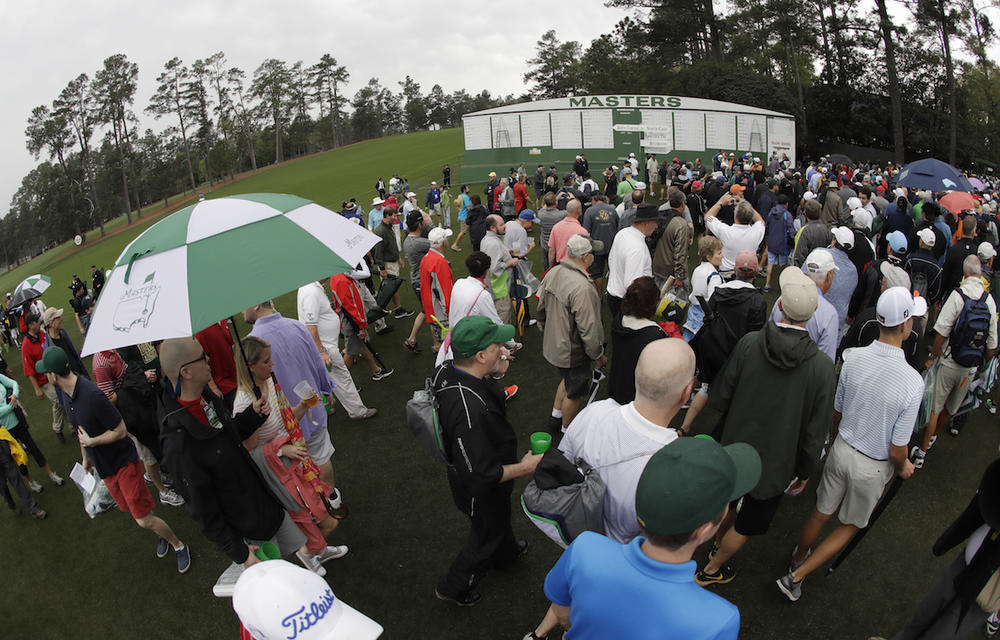 Fans leave Augusta National for a weather warning during a practice round for the Masters golf tournament Wednesday, April 5, 2017, in Augusta, Ga. 