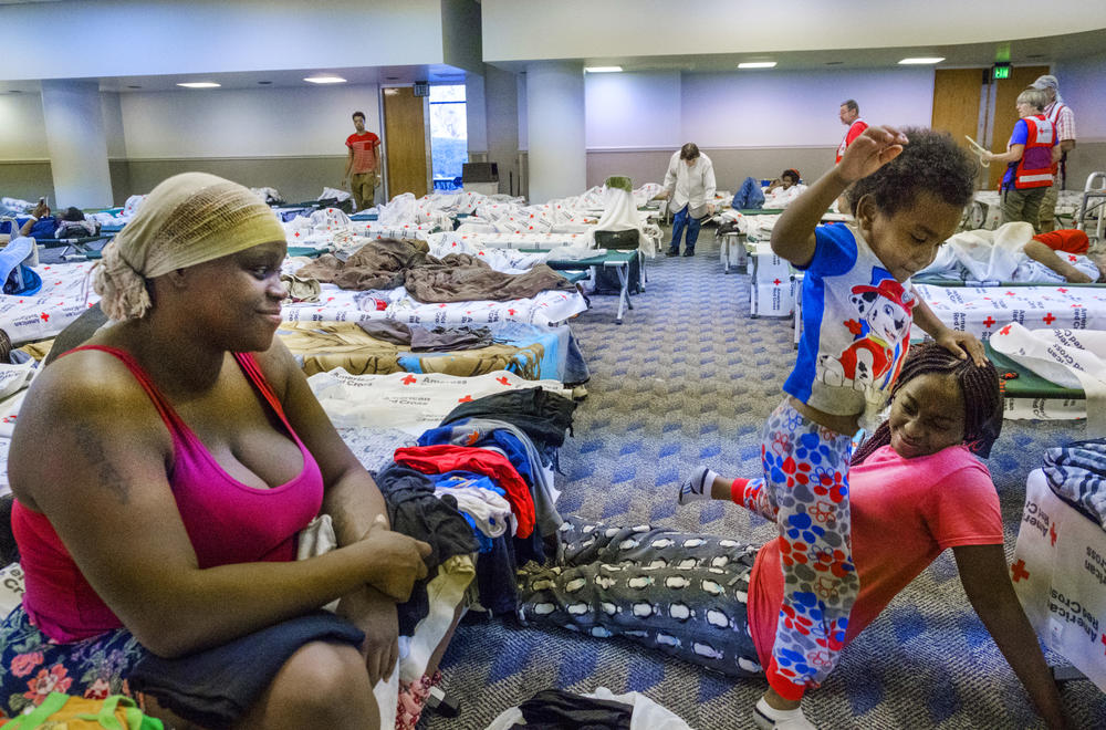 Shayvonda Edwards, left, in a Red Cross shelter in Albany last October, had only settled down in Albany after moving from Fort Lauderdale when her apartment was destroyed by Hurricane Michael, leaving her homeless. 