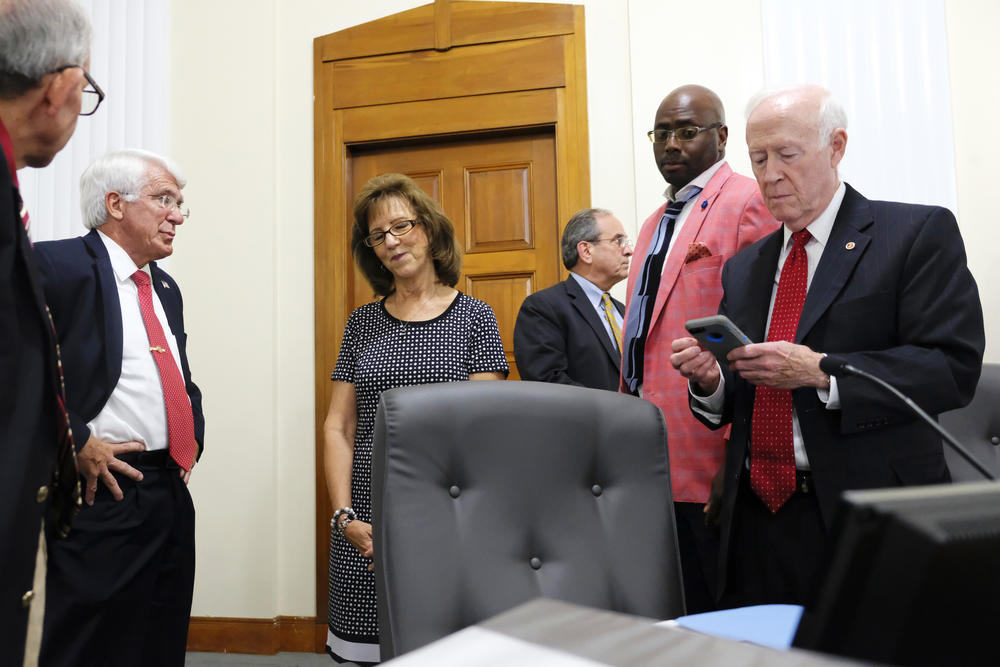 Macon-Bibb County Commissioners Valerie Wyn, third from left, and Mallory Jones, right, spearheaded an effort to derail a proposed property tax hike in Macon Tuesday.