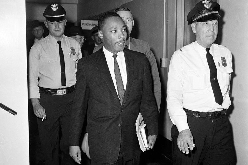 In this Oct. 25, 1960 file photo, Dr. Martin Luther King Jr. leaves court after being given a four-month sentence in Decatur, Ga., for taking part in a lunch counter sit-in at Rich's department store. Following the publication of 