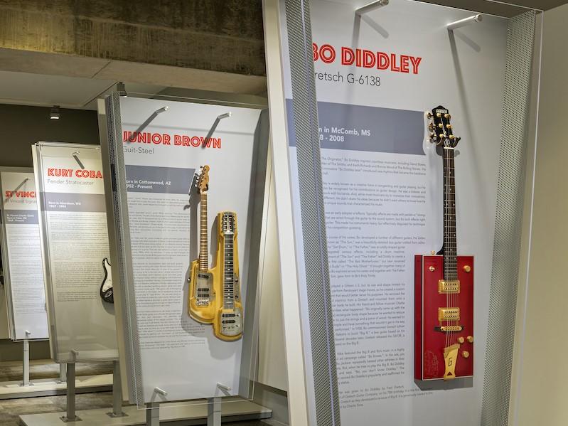 There are a number of iconic guitars on display, including models from Bo Diddley, Junior Brown, St. Vincent and James Hetfield of Metallica.