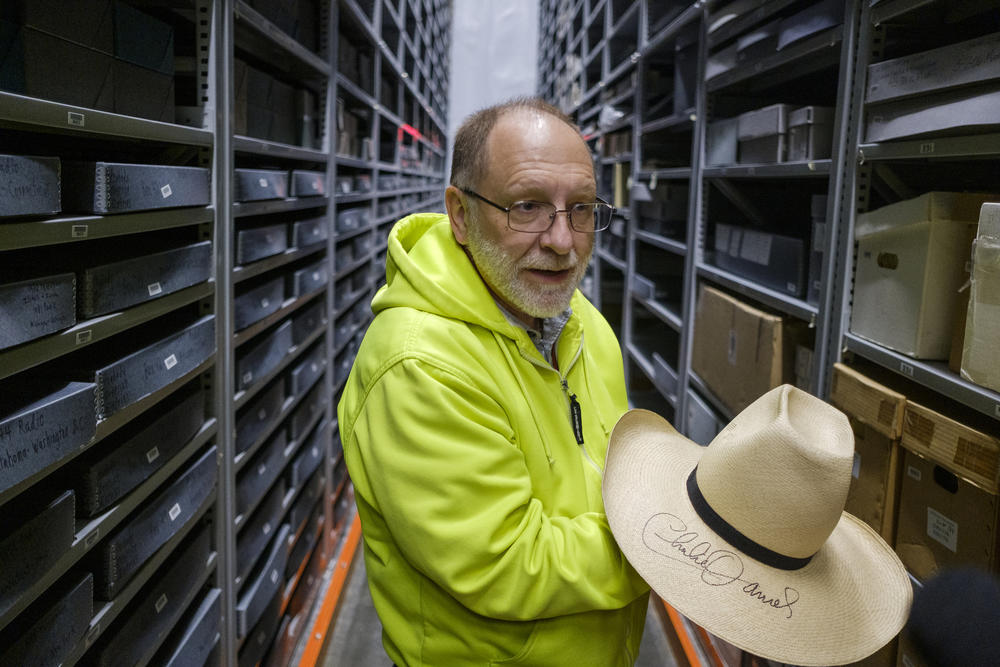 Paul Van Wicklen holds in the vault of the Georgia music collection a hat that belonged to country musician Charlie Daniels. The hat is an example of some of the things in the Georgia music collectition where Van Wicklen is vault manager. 