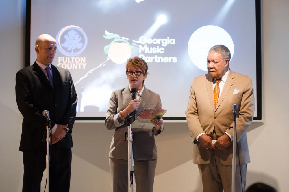 Shachar Oren with Georgia Music Partners, joing Sherri McConnell with Sound Mobility, and Fulton County Chairman Rob Pitts to announce a study of the economic impact of the county's music industry. 