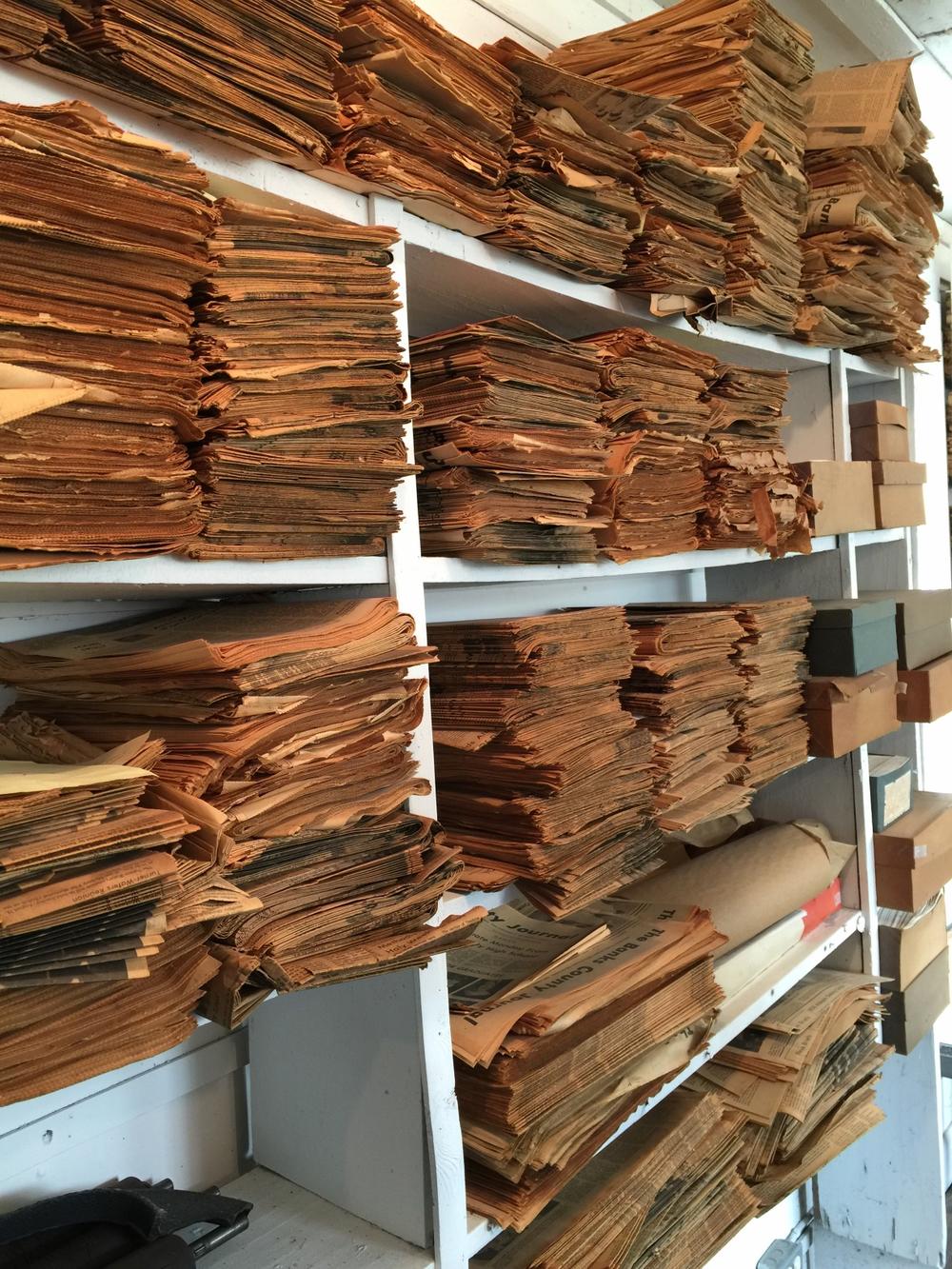 Stacks of old newsprint line the walls of the Georgia Weekly Newspaper Musuem in Homer.