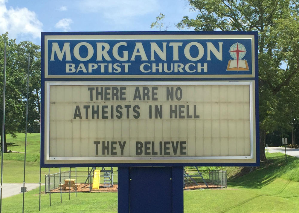 A sign in front of the Morganton Baptist Church reads, 