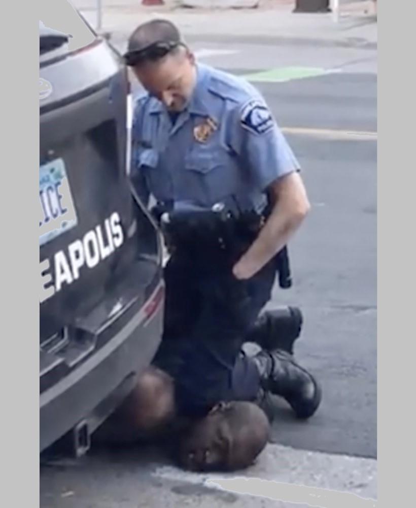 In this Monday, May 25, 2020, frame from video, a Minneapolis officer kneels on the neck of a handcuffed man who was pleading that he could not breathe in Minneapolis. 
