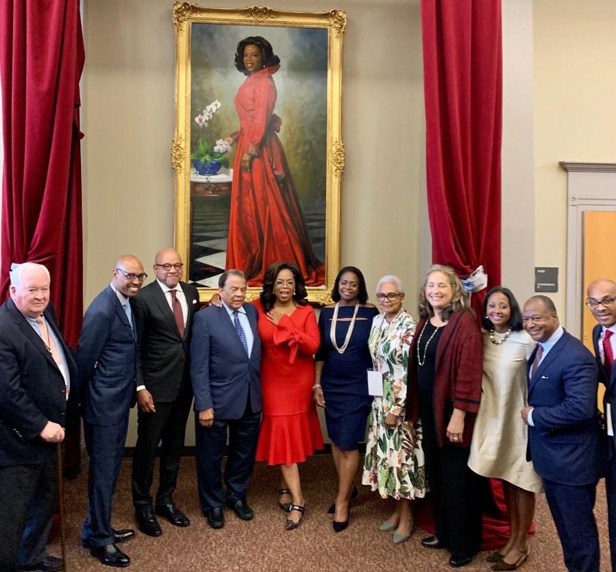 Winfrey poses in front of a painting of her likeness. The portrait was unveiled on Monday at Morehouse College in Atlanta