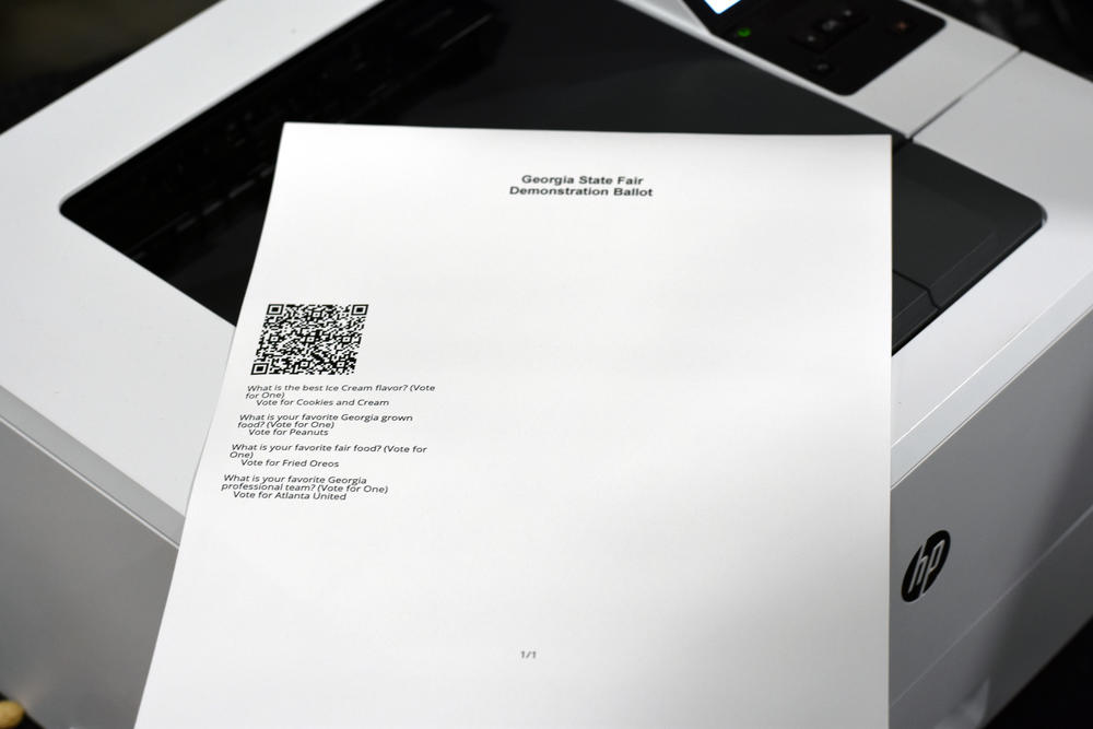 Georgia's new ballot-marking device voting system adds a paper component. This piece of paper, which contains a QR code and a textual summary of the races and a voter's selection, is then inserted into a scanner to be counted and stored.