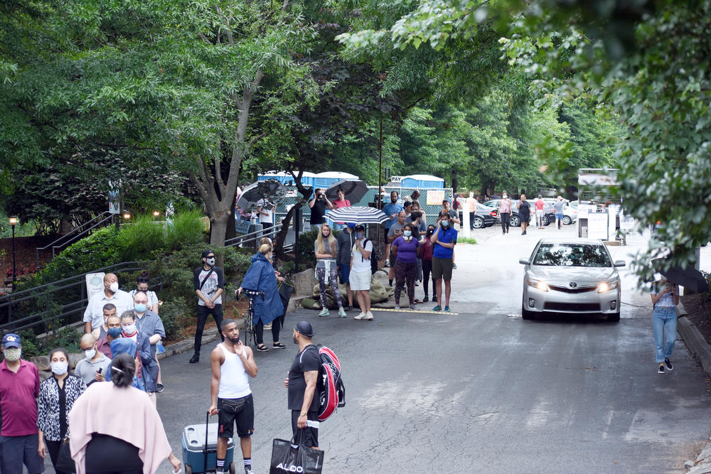 Lines stretched for several hours at Park Tavern in midtown Atlanta, where 16,000 active registered voters were assigned to a single polling place.