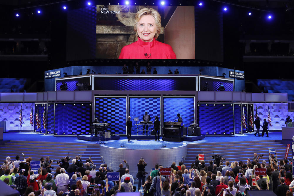 Democratic presidential candidate Hillary Clinton appears on a large monitor to thank delegates during the second day of the DNC in Philadelphia.