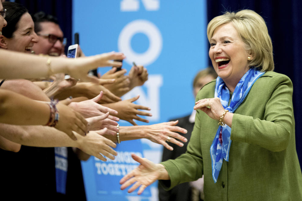 Democratic presidential candidate Hillary Clinton arrives at a rally at Adams City High School in Commerce City, Colo., Wednesday, Aug. 3, 2016.