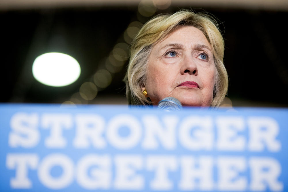 Democratic presidential candidate Hillary Clinton pauses while speaking at a rally at the Coliseum in St. Petersburg, Fla., Monday, Aug. 8, 2016.