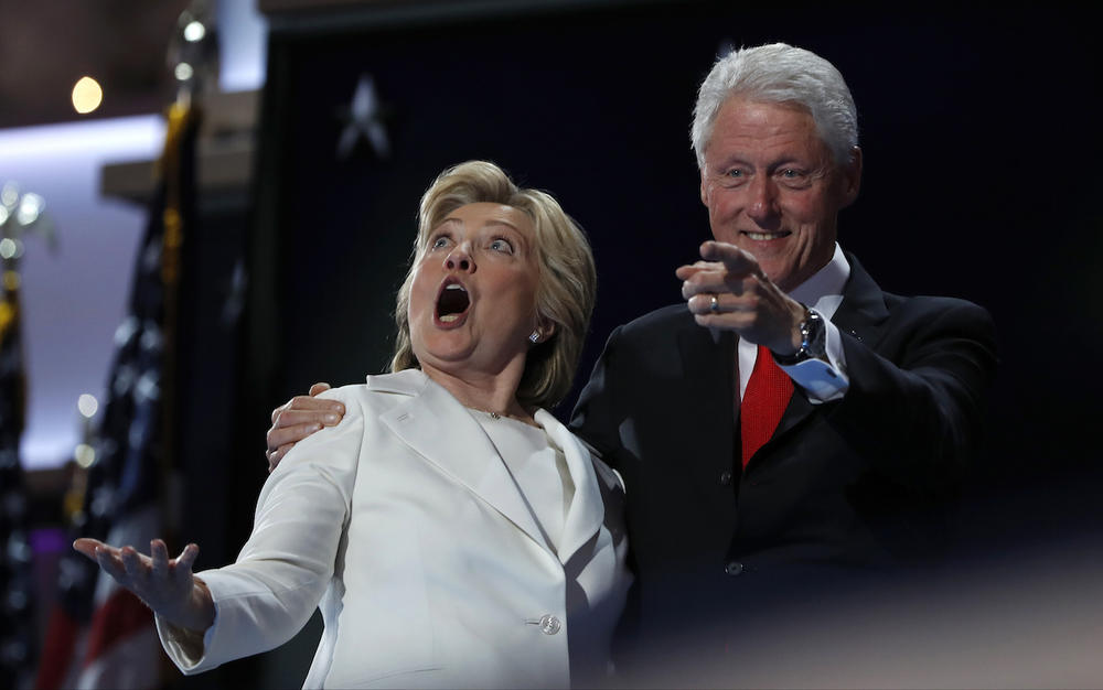 Democratic presidential nominee Hillary Clinton and Former President Bill Clinton react as balloons fall during the final day of the Democratic National Convention in Philadelphia, Thursday, July 28, 2016.