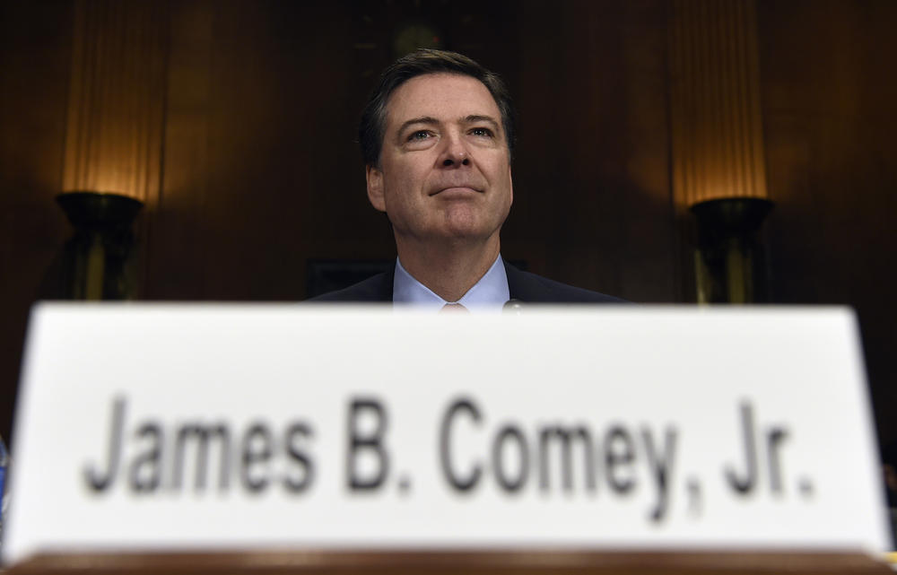 In this Dec. 9, 2015 file photo, FBI Director James Comey prepares to testify on Capitol Hill in Washington. Comey announced last week that the FBI is reviewing new emails possibly relevant to Hillary Clinton's private email server investigation.