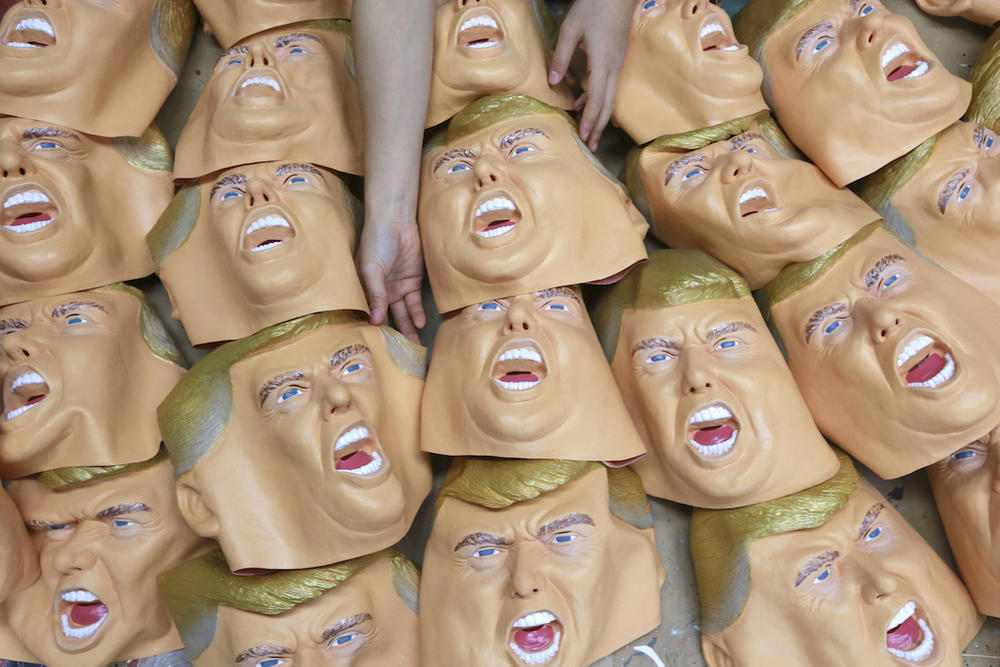 A worker prepares for final touches on rubber masks depicting President-elect Donald Trump at the Ogawa Studio in Saitama, north of Tokyo, Tuesday, Nov. 15, 2016.