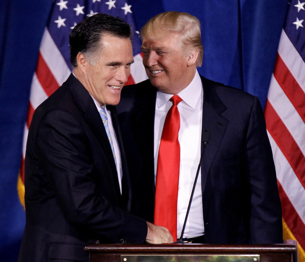 Donald Trump greets Republican presidential candidate, former Massachusetts Gov. Mitt Romney, after announcing his endorsement of Romney during a news conference, Thursday, Feb. 2, 2012, in Las Vegas. 