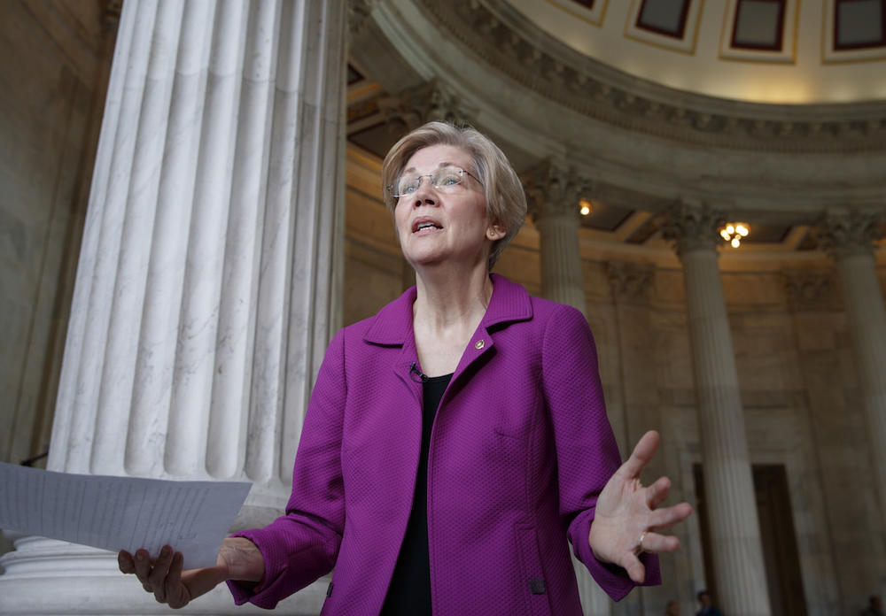 Holding a transcript of her speech in the Senate Chamber, Democratic Sen. Elizabeth Warren of Massachusetts reacts to being rebuked by the Senate leadership and accused of impugning a fellow senator, Wednesday, Feb. 8, 2017. 