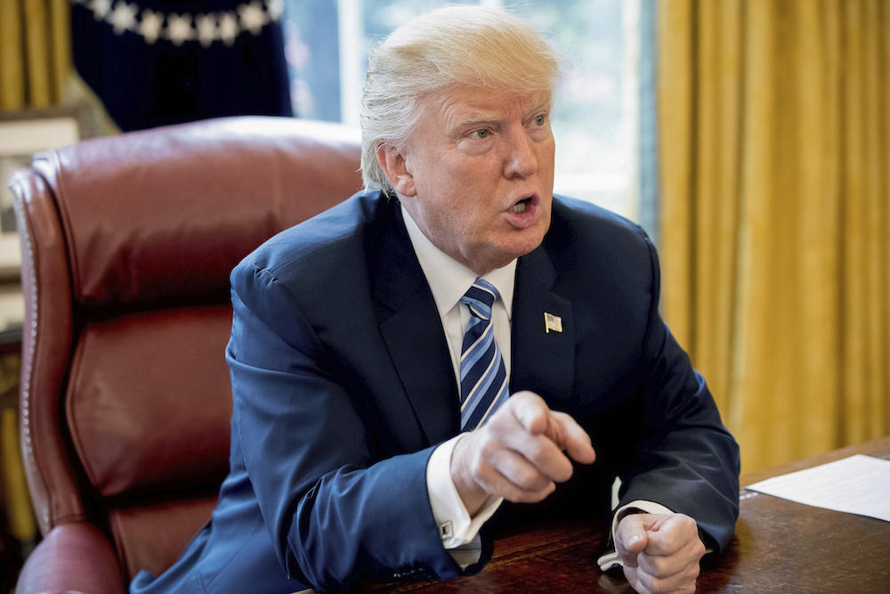 President Donald Trump speaks to Associated Press Chief White House Correspondent Julie Pace in the Oval Office in Washington, Friday, April 21, 2017. 