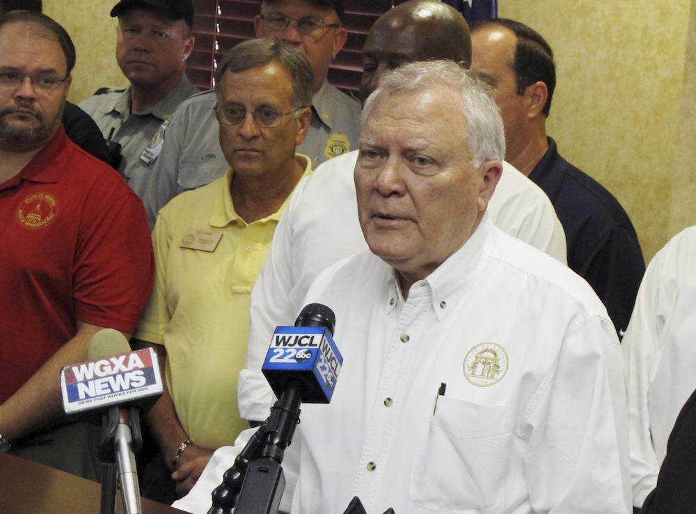 Georgia Gov. Nathan Deal speaks to reporters after surveying storm damage from Irma on Thursday, Sept. 14, 2017, at the airport in Brunswick, Ga. Deal described Irma as a "catastrophic event" for the Georgia coast.