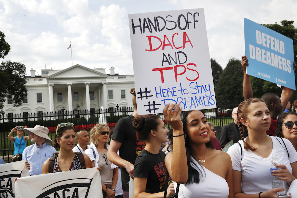 Yurexi Quinones, 24, of Manassas, Va., a college student studying social work and a recipient of DACA, rallies next to Ana Rice, 18, of Manassas, Va., far right, in support of DACA, outside of the White House.