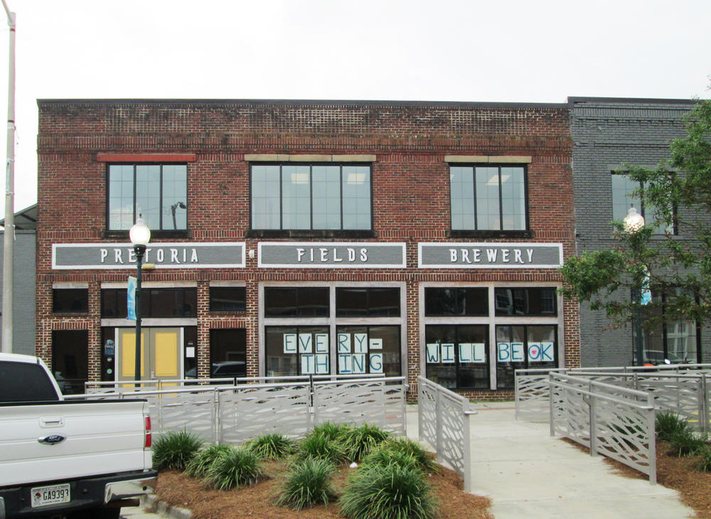 Signs in the windows of the Pretoria Fields Brewery in Albany aimed at reassuring residents coping with coronavirus. The brewery recently began making hand sanitizer. 