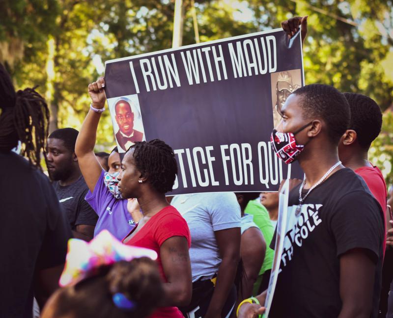 Protesters gathered evening to demand answers and action on the February shooting death of Ahmaud Arbery.