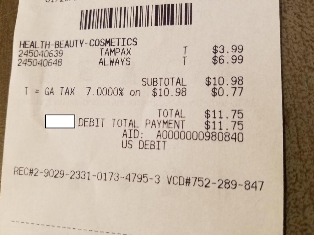 A receipt for tampons and menstrual pads shows the state and local sales tax on those items.