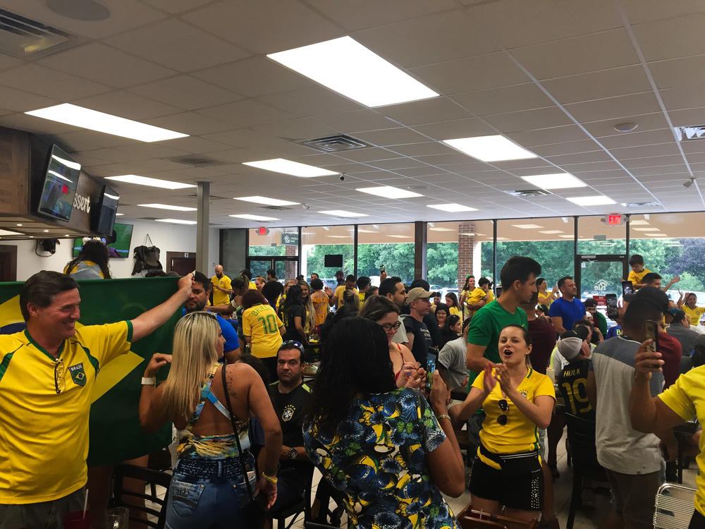 The crowd of hundreds at Rio Steakhouse and Bakery in Marietta, Georgia cheers after Brazil advances to the World Cup round of eight.