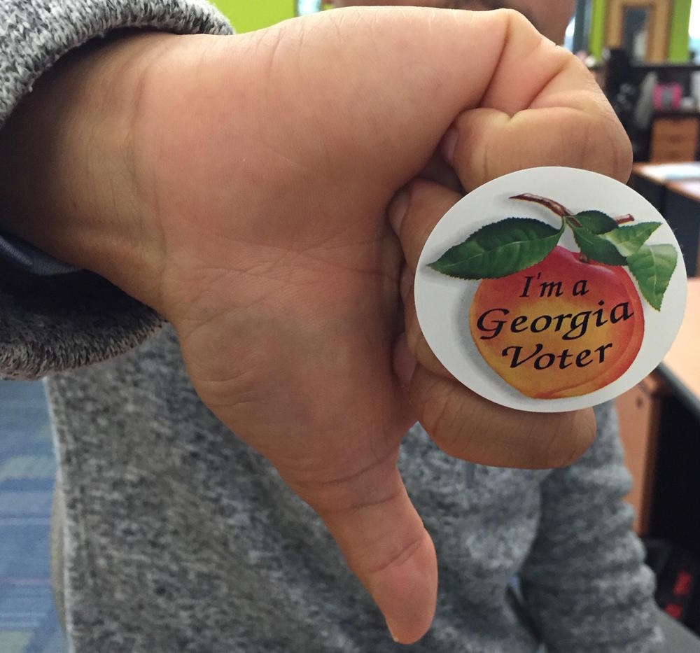 Dissatisfied with both Trump and Clinton, some Georgia voters are only voting in down-ballot races.