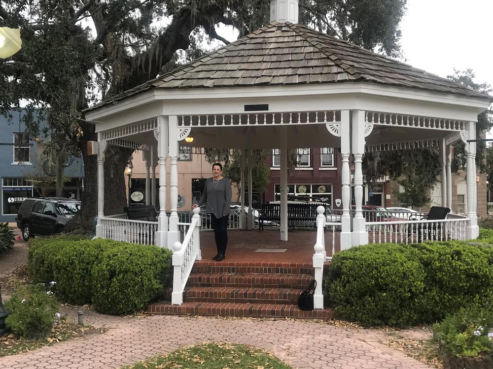 Roslyn Palmer stands beneath the gazebo in Bainbridge's city square.